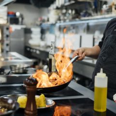 side-view-male-chef-flambeing-dish-scaled.jpg