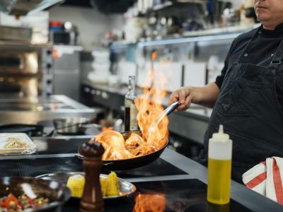 side-view-male-chef-flambeing-dish-scaled.jpg
